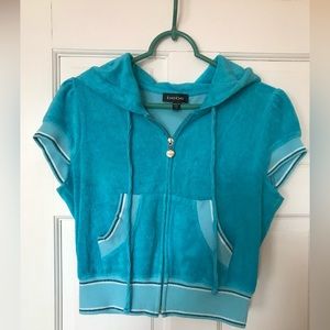 Bebe bright blue short sleeved hooded top in size M. Gently used condition.